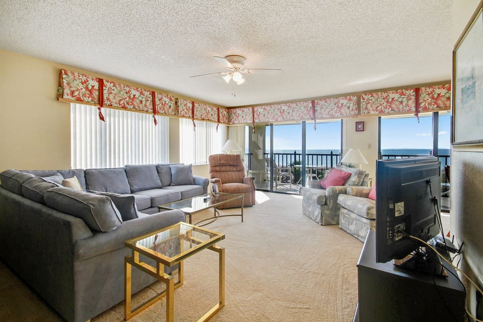 Seating for everyone in your cozy living room with beach view and TV