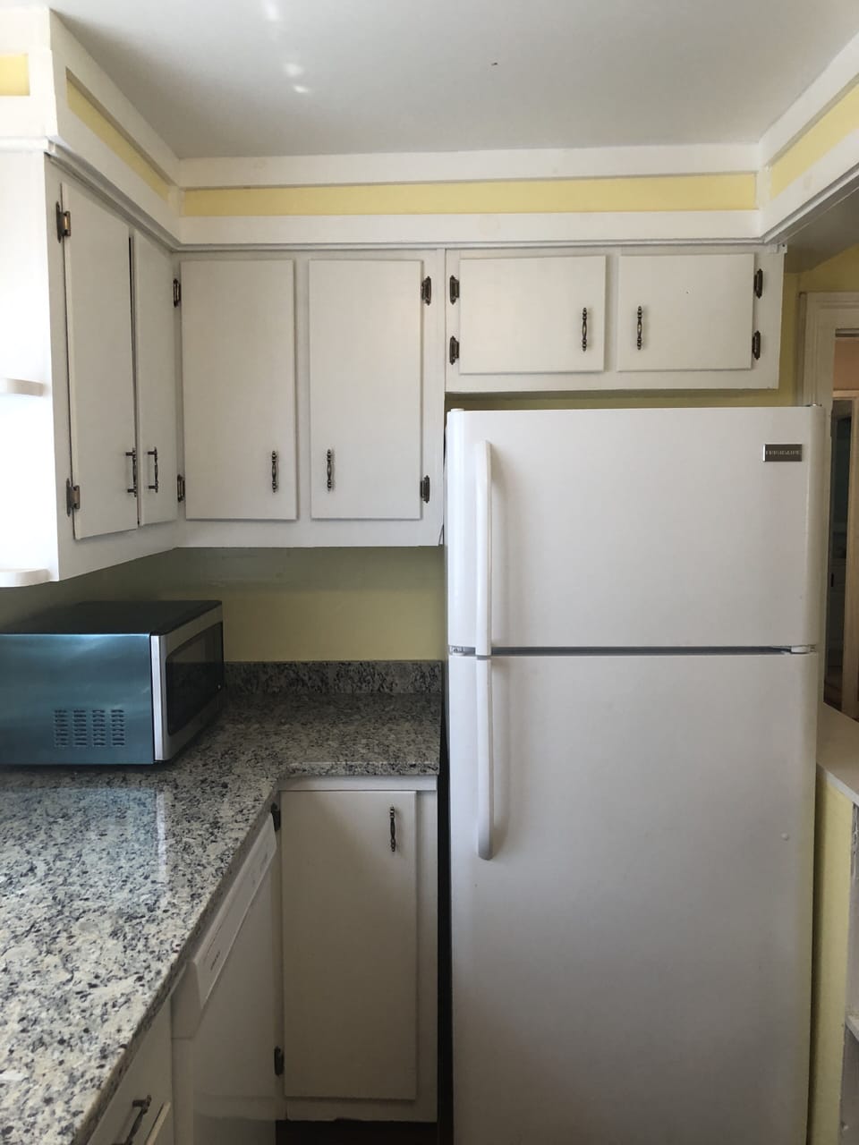 Kitchen with granite countertop.
