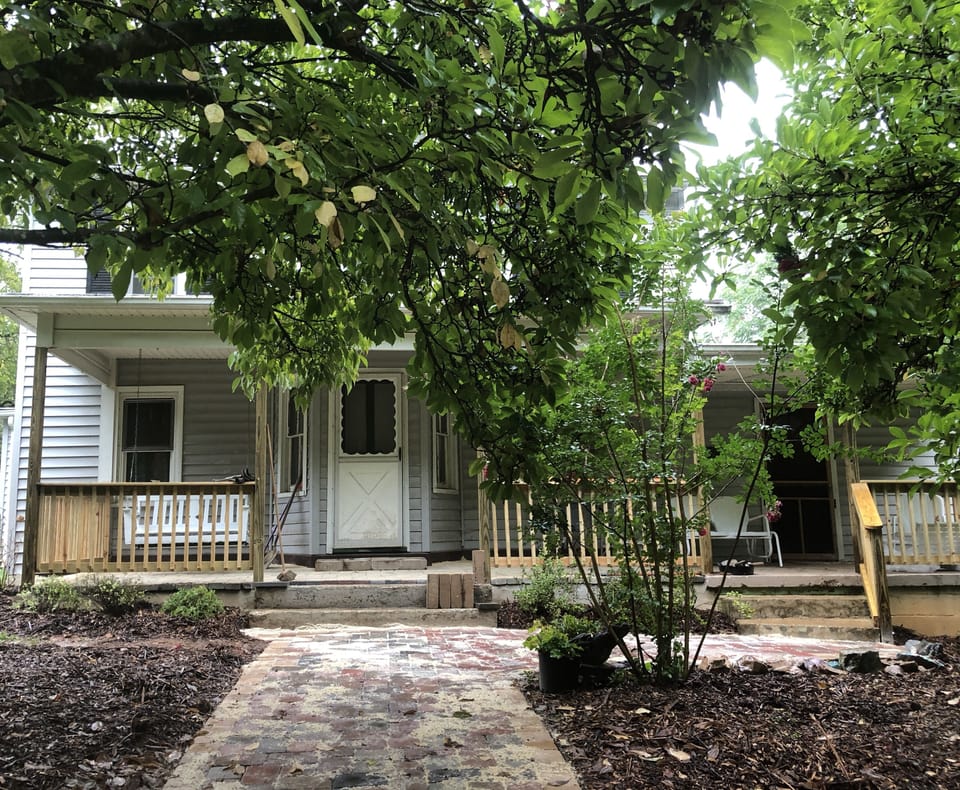 Entrance to patio and front porch--complete with swing and glider.