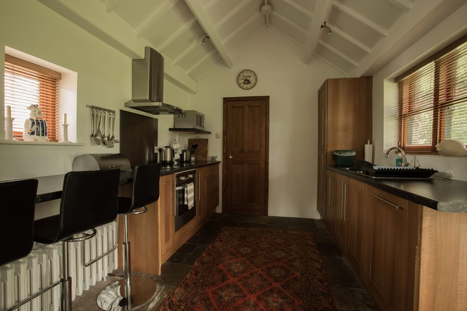 kitchen with oven, fridge freezer and dishwasher. Washing machine in utilityroom