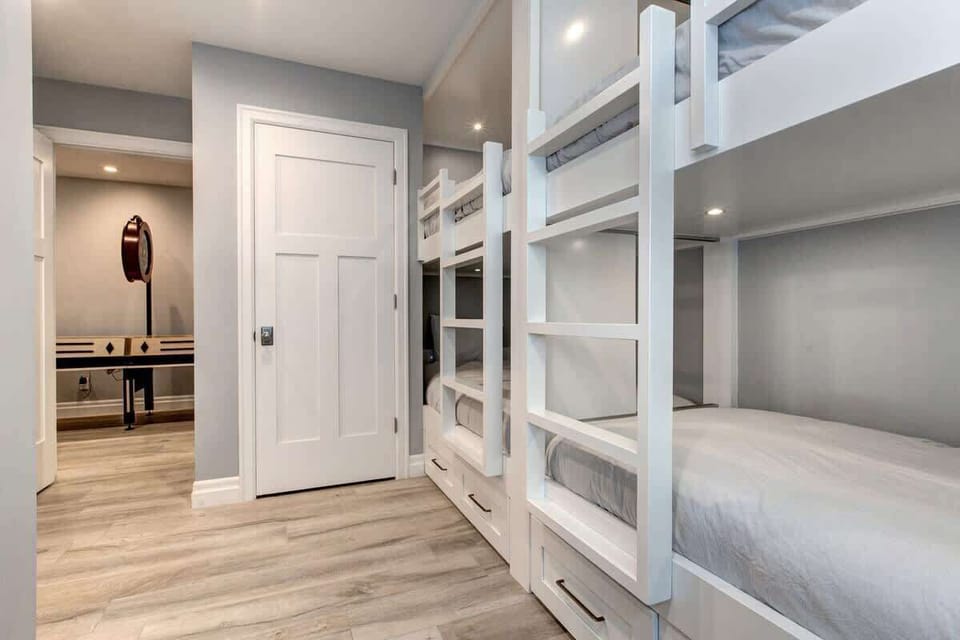 Bedroom 5 | Lower Level, 2 Sets of Twin over Twin Bunks, TV, Closet, Full Ensuite Bathroom with Shower | Abode at First Chair