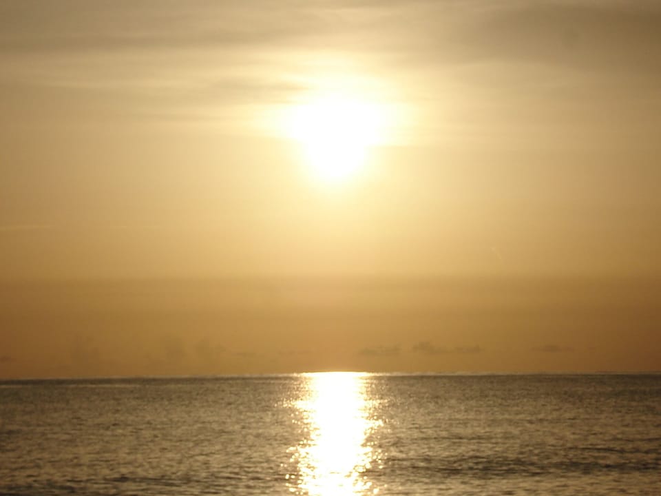 Enjoy a beautiful sunset with a glass of wine