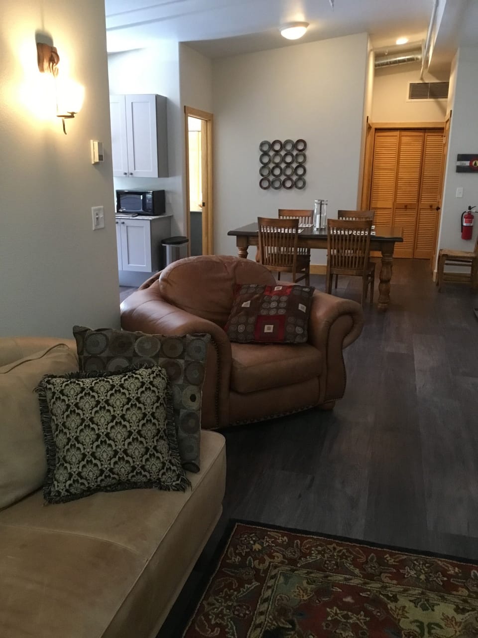 Leather couch and chair in living room. 