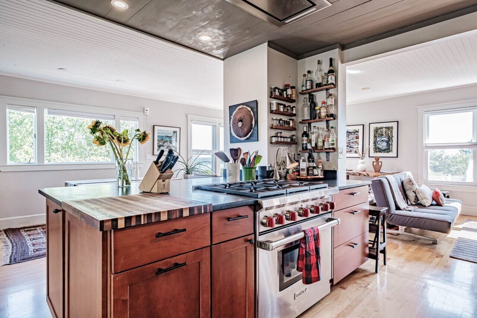 Kitchen with Wolf 6 burner chef`s stove and oven