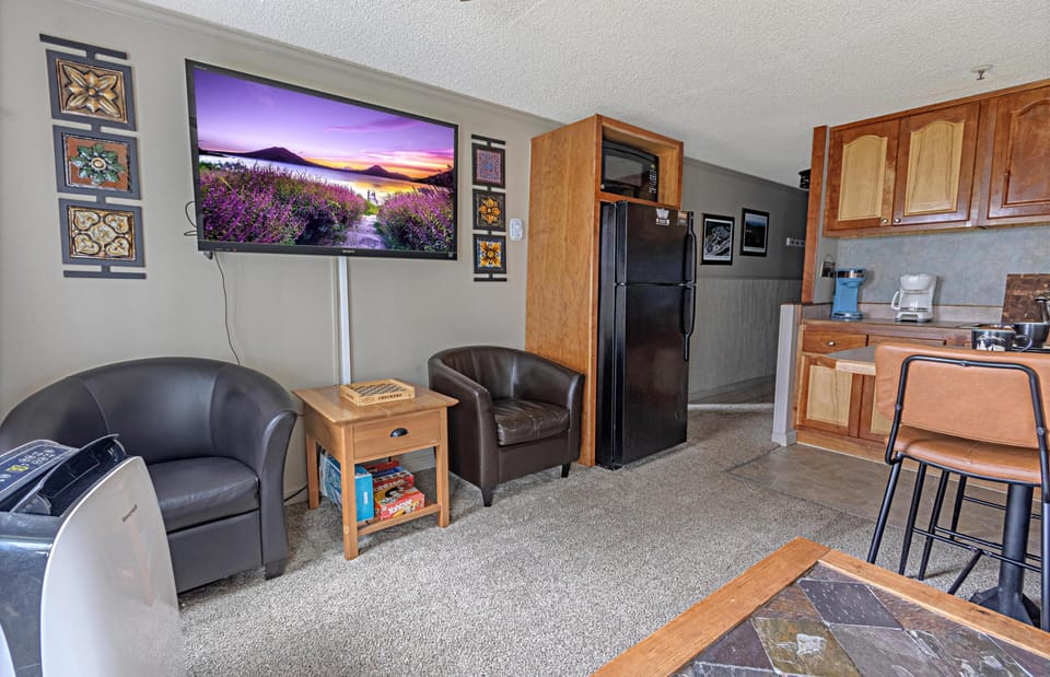 The cozy living room area with a 50" TV.