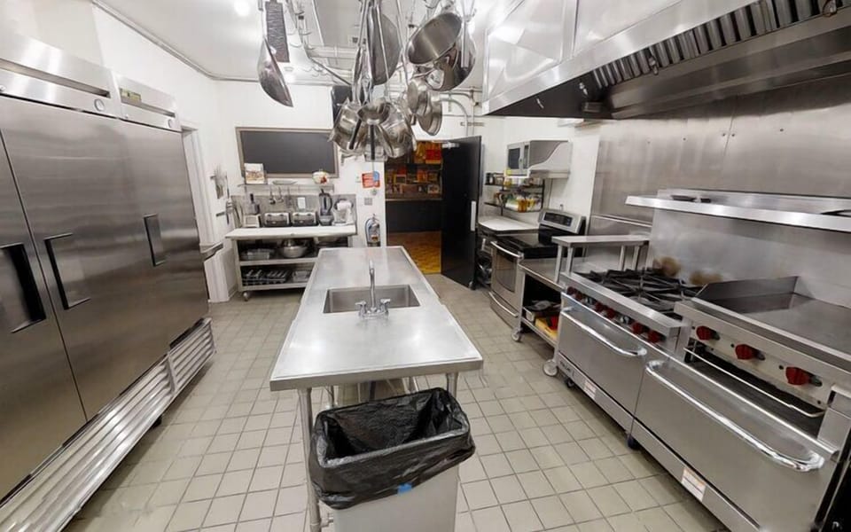 Commercial appliances incl dishwasher. Not pictured 2 add’l convection ovens. 