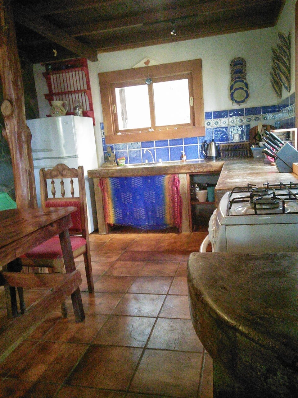 Authentic Costa Rican kitchen with rustic concrete countertops.