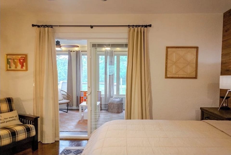 Primary bedroom opens up to sunroom 