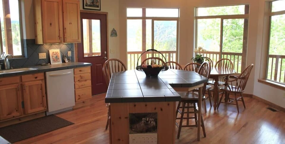 We have a kitchen island for the family to gather around, and a kitchen table at which meals can be enjoyed. 