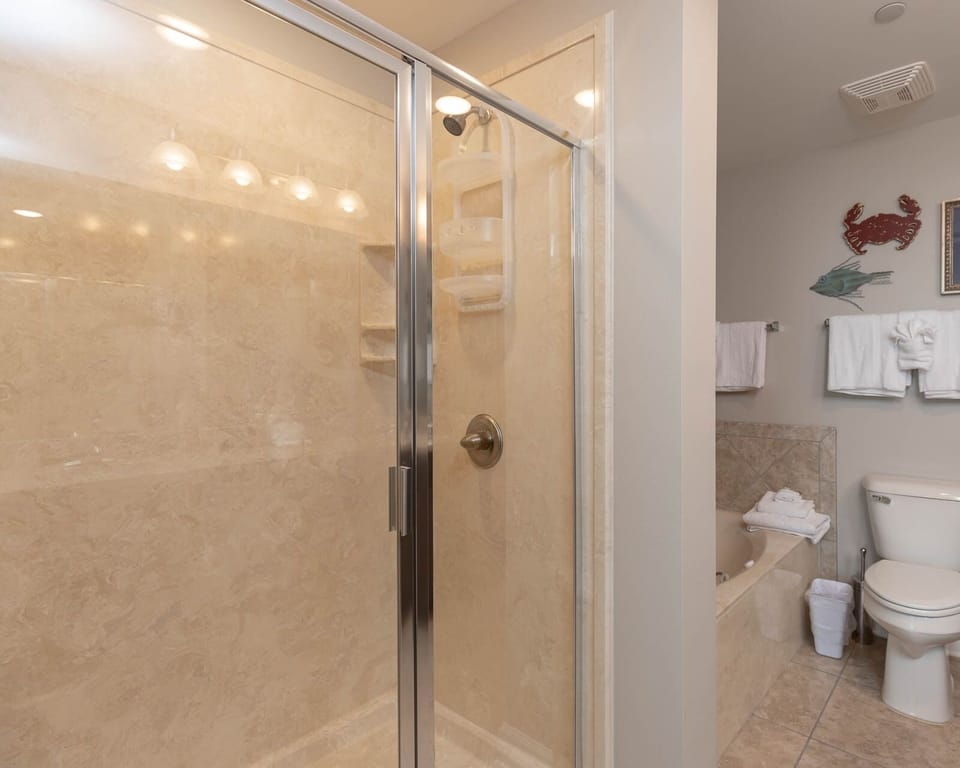 Indulge in relaxation in the master bath with a refreshing walk-in shower and soothing jetted tub