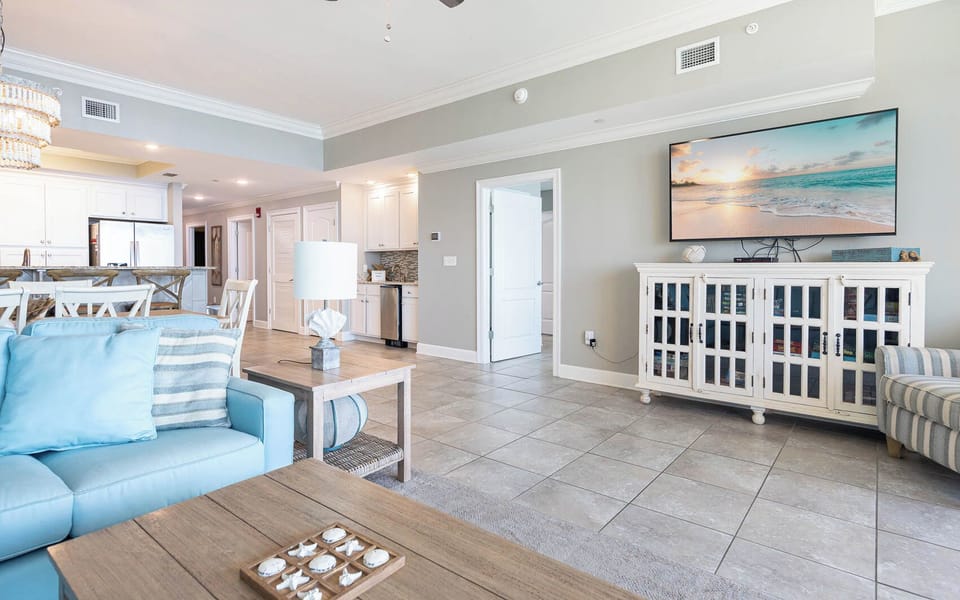 Relax in the inviting living area, gather together with a good movie, and feel the coastal ambiance surround you