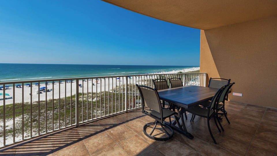 Relax on your balcony and bask in the sunlight with mesmerizing views of the gulf coast on your beach retreat
