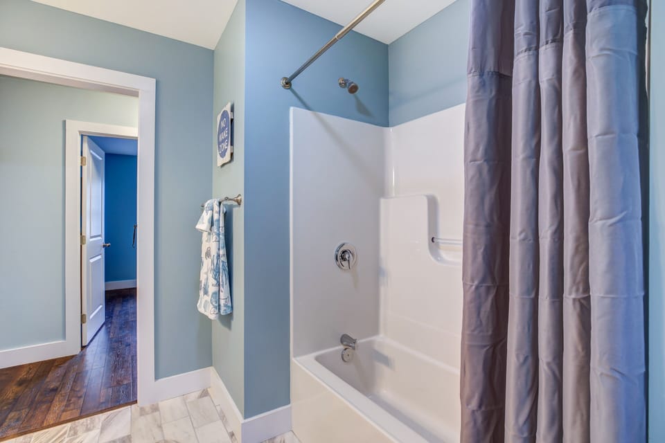 Full Bath 1 is just across the hall from the 1st Floor Bedroom.