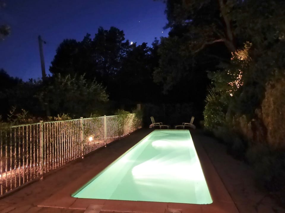 Magical pool under the moon and stars
