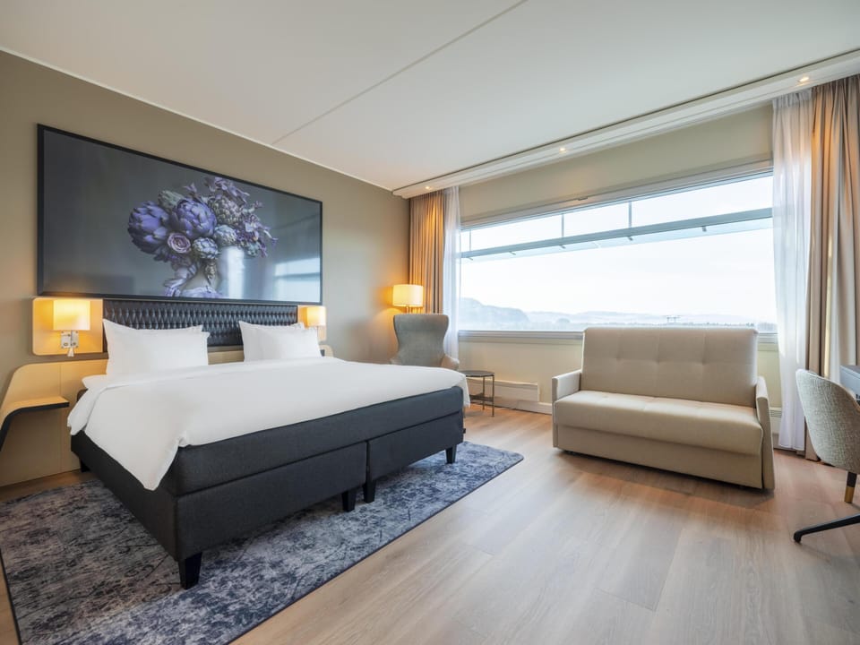 Premium Room (Fjord & Runway View) | Premium bedding, down comforters, pillowtop beds, minibar
