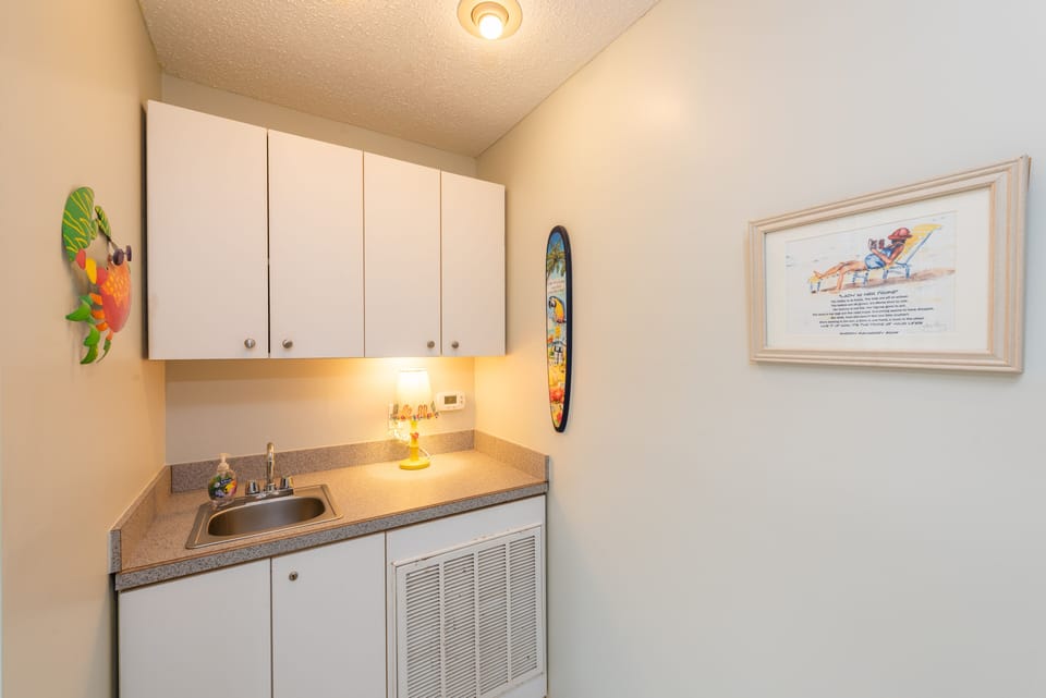 Laundry Area at Bottom Of Circular Stairs