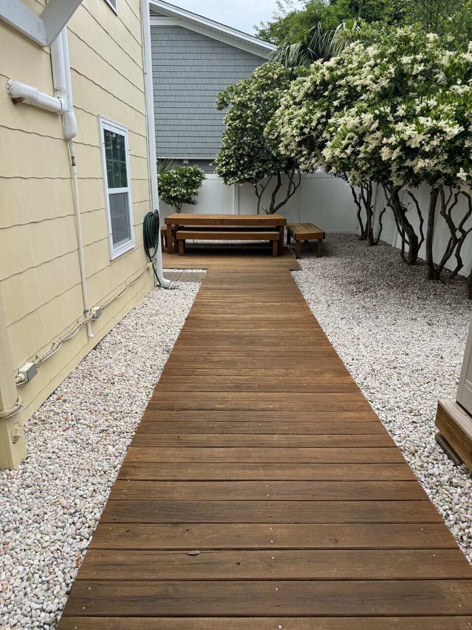 Right side of Property Back Yard with large table.
