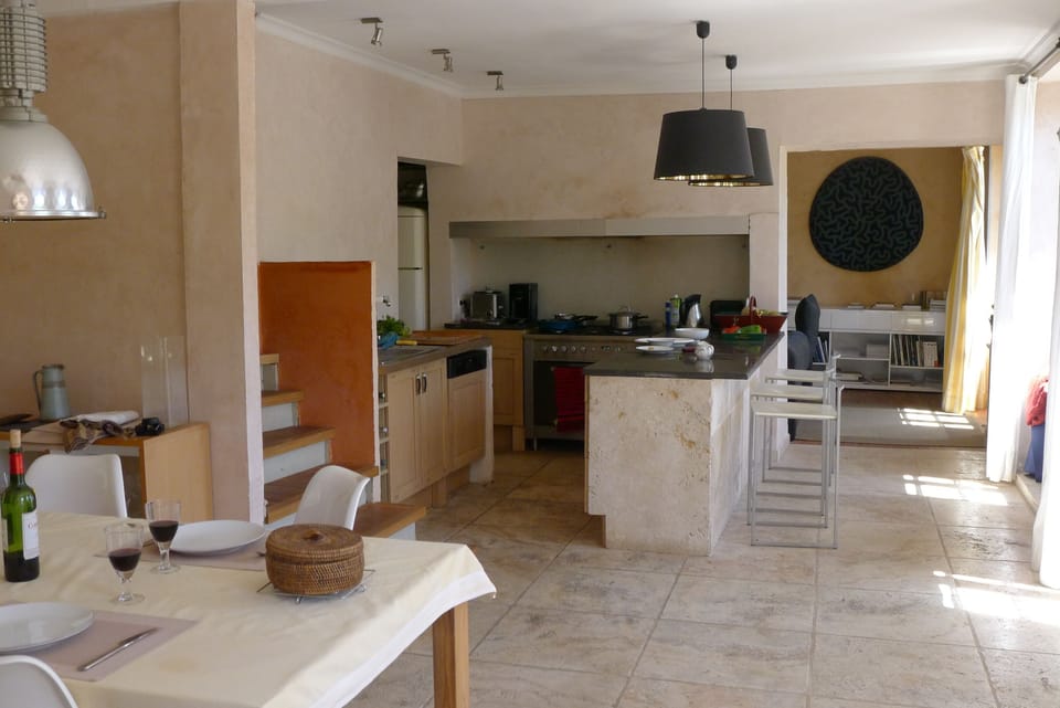 Kitchen with view of dinning room and sitting room beyond.