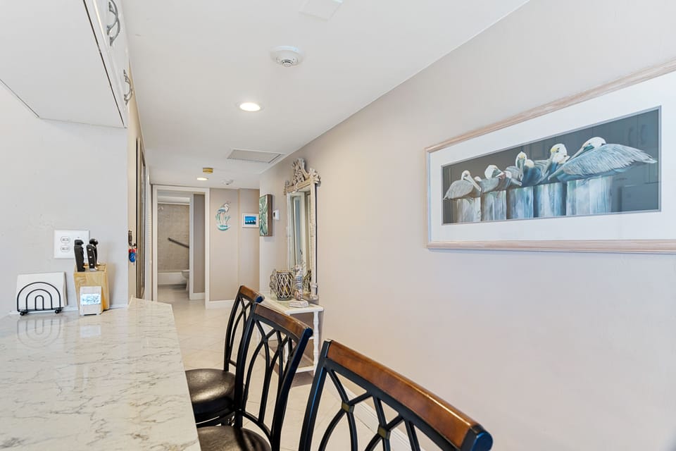 Kitchen area looking towards entrance of unit