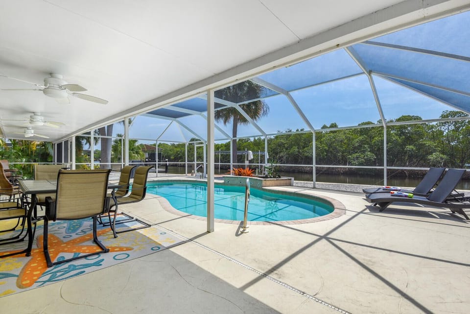 Enjoy a dip in the pool- featuring a brand new screened in porch. 