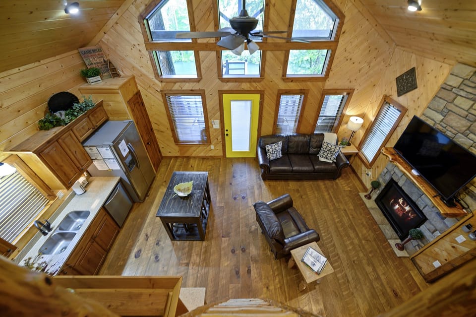 Looking downstairs from the loft with a queen and twin bed.