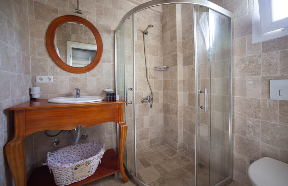 Shower, free toiletries, hair dryer, slippers