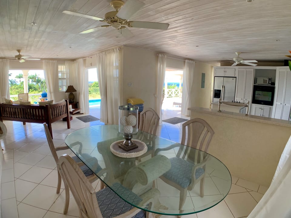 Inside dining room looking at kitchen and day bed