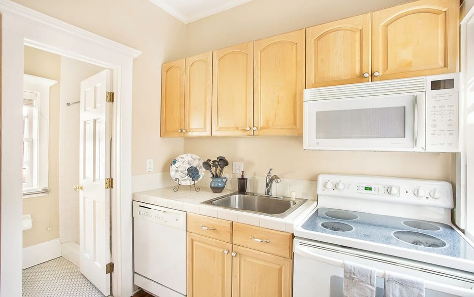 A full size kitchen can be found behind the bedroom.