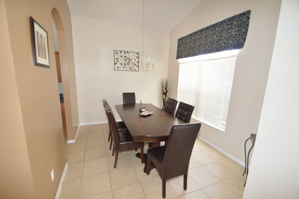 Dining room with leather chairs - seats up to 8 guests.