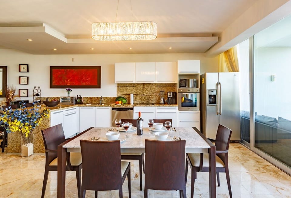Large kitchen and dining area with full-size refrigerator, dishwasher and views!