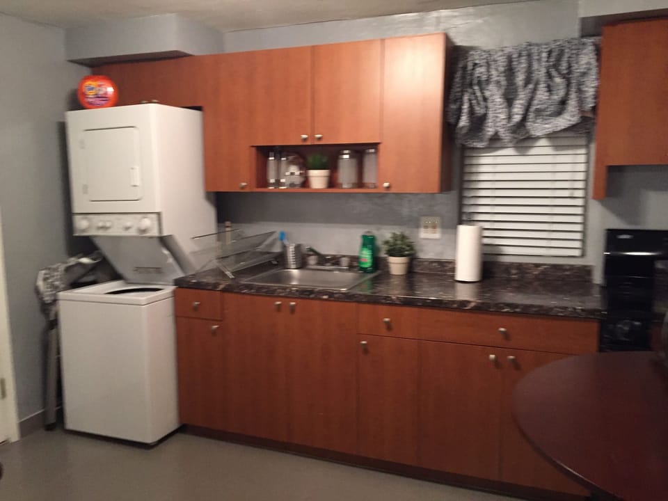 Kitchen, with washer dryer, microwave and regular oven, toaster, coffee maker