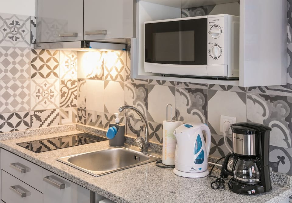 Apartment, 1 Bedroom | Private kitchen | Fridge, microwave, stovetop, coffee/tea maker