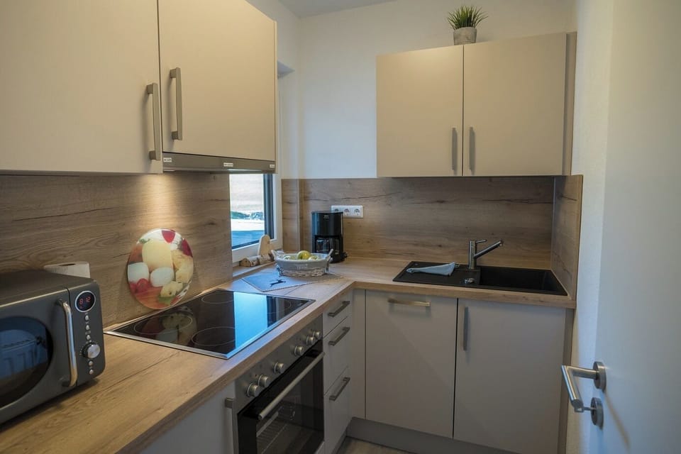 Comfort Apartment, 1 Bedroom, Non Smoking, Mountain View | Private kitchen | Microwave, electric kettle, highchair, cleaning supplies