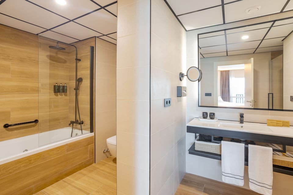 The Level Grand Premium Room Adults Only | Bathroom | Designer toiletries, hair dryer, bathrobes, slippers