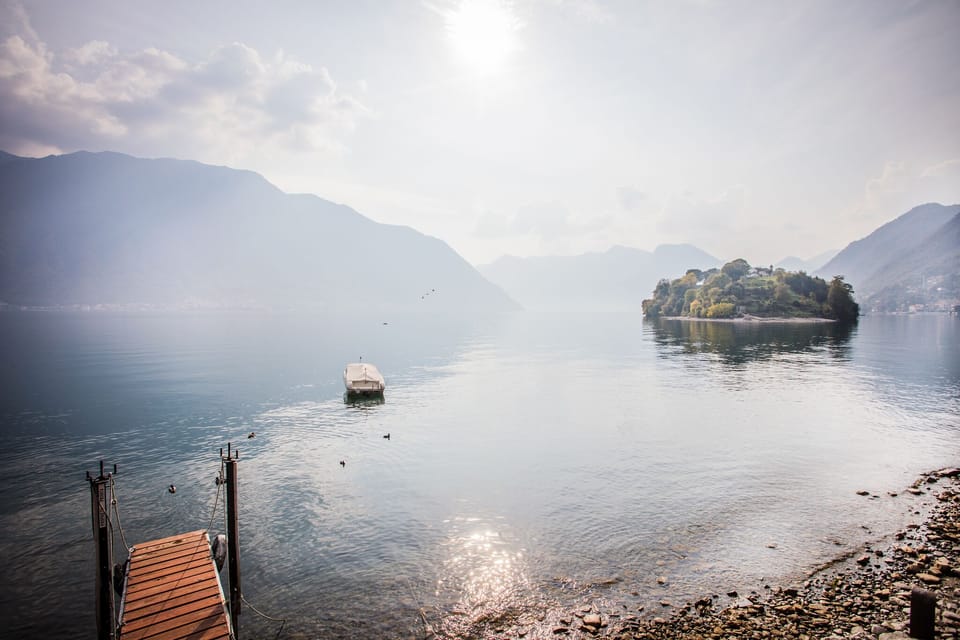 The lake, boat mooring and shingle beach here at "Darsena Ossuccio" 