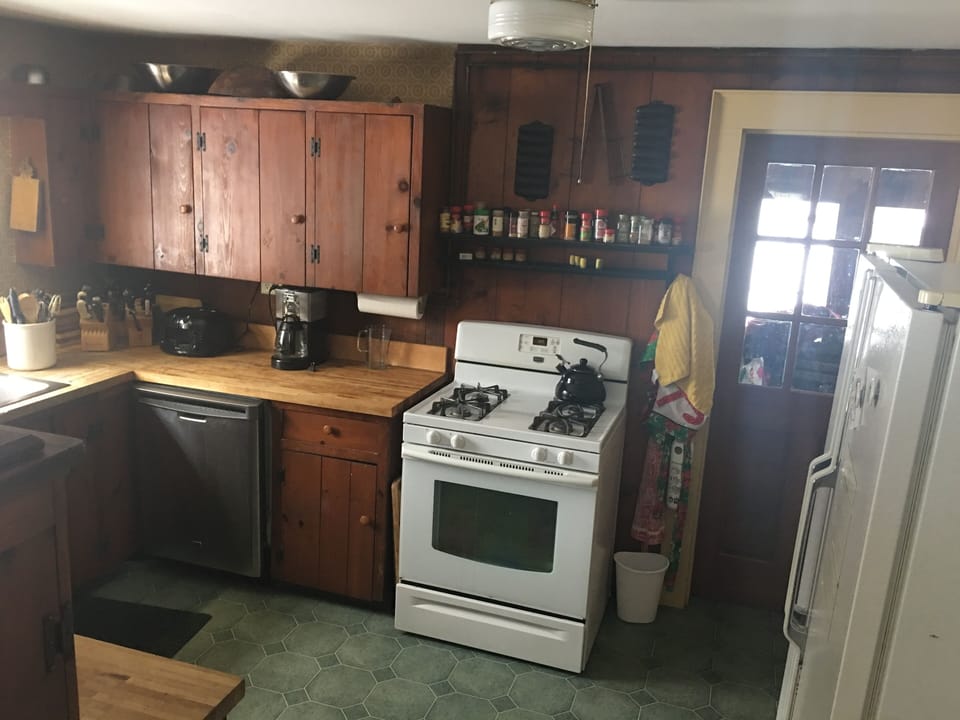 kitchen gas stove and side by side refrigerator


