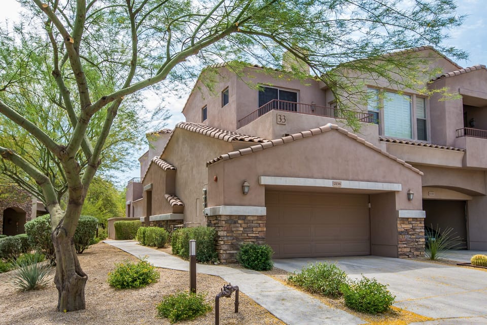 Front exterior view - end unit w/ 2 car attached garage