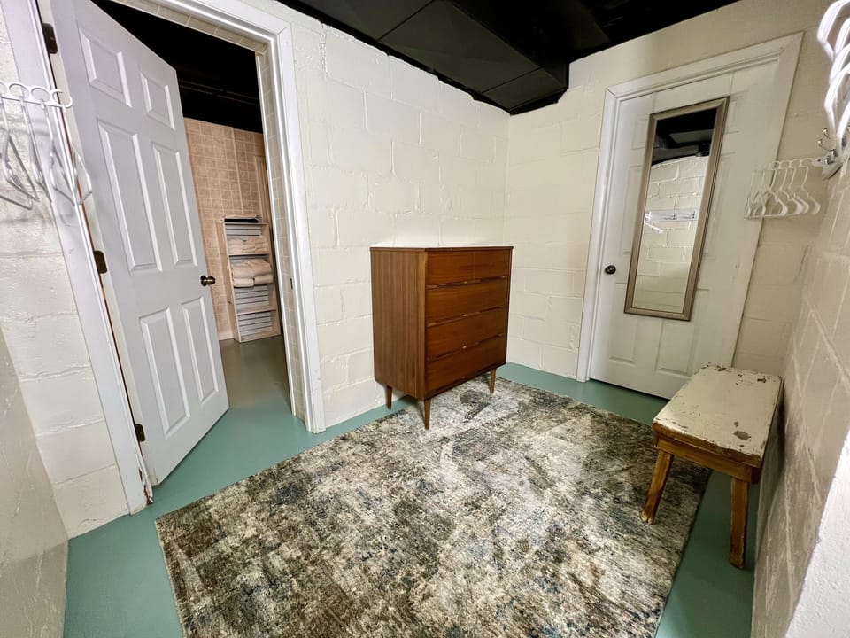 BASEMENT DRESSING AREA: Between bsmnt bathroom & bsmnt game room/sleeping area