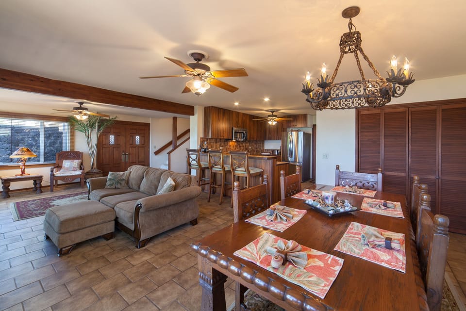 Dining room and living room combine with open space and  ocean views.