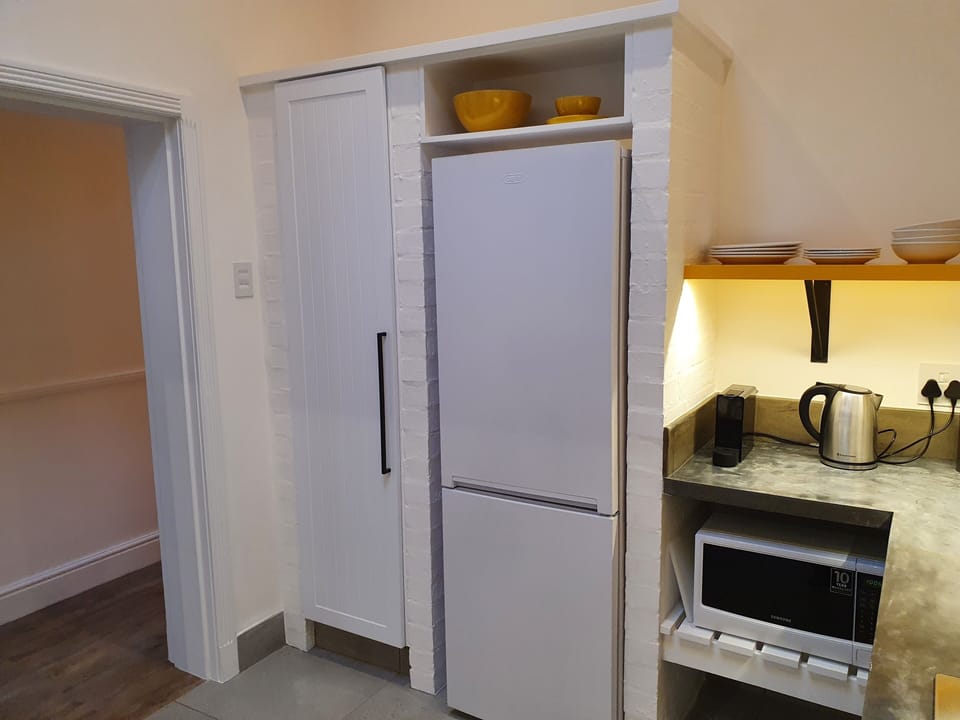 Cottage, 1 Bedroom, Private Courtyard, Outdoor Shower (165 Waterkant Street 2 night min stay) | Private kitchen | Fridge, microwave, oven, stovetop