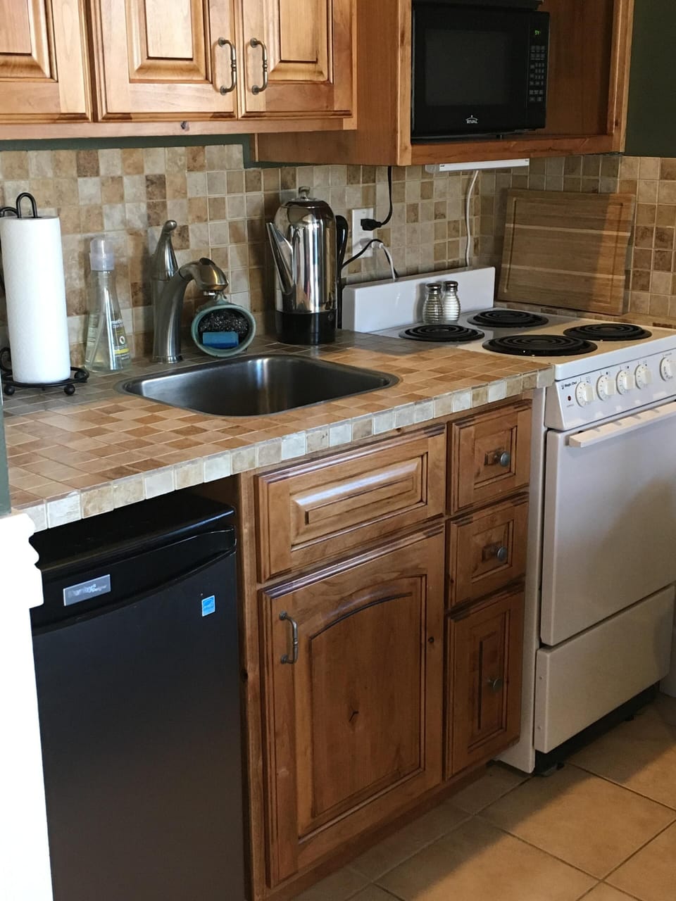 lots of good quality pots and pans under cabinet