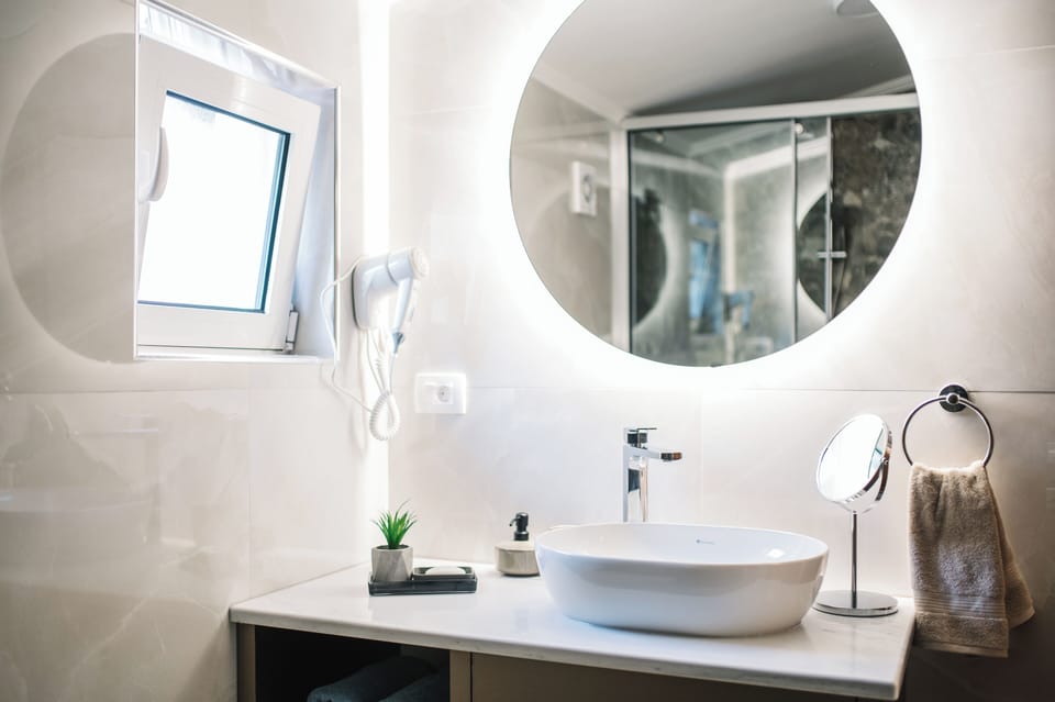 Shower, hair dryer, slippers, towels