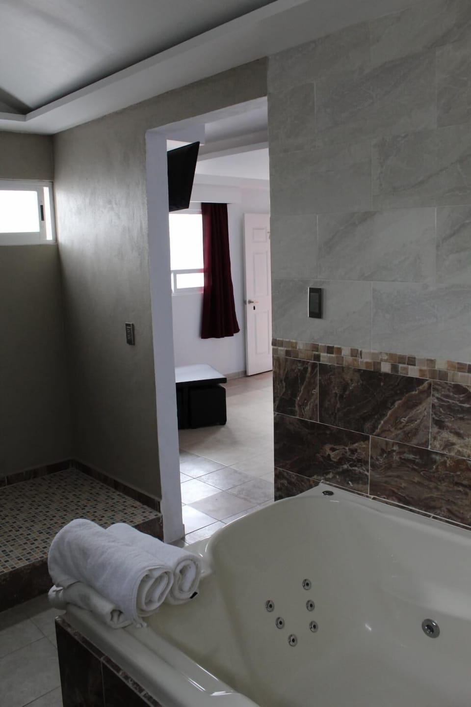 Shower, free toiletries, slippers, towels