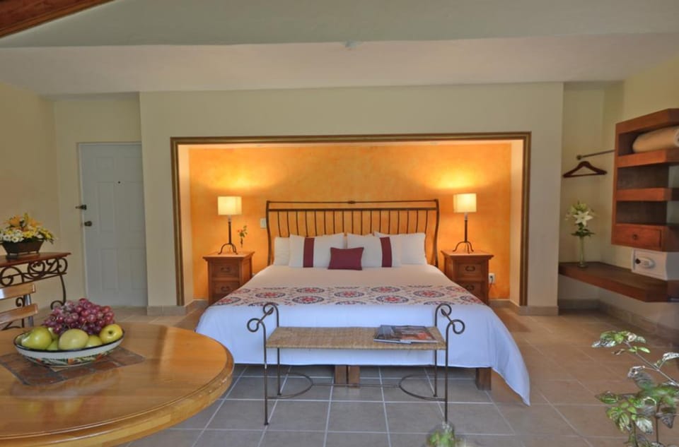 Desk, iron/ironing board, bed sheets