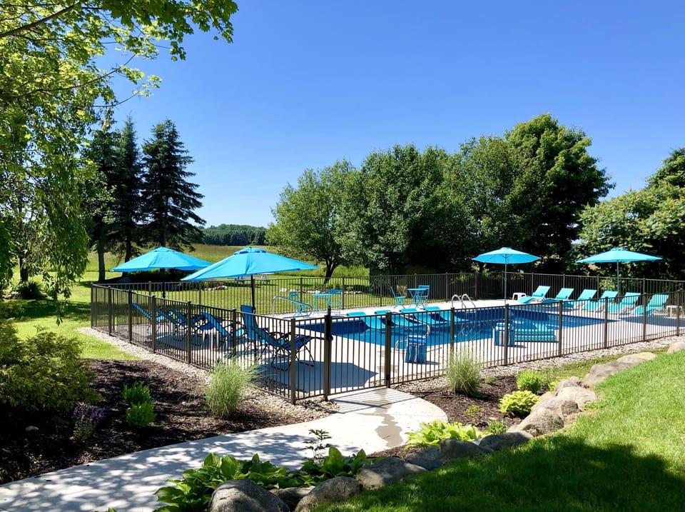 BACKYARD: pool(self-closing fence), hot tub, fire pit, grill, dining seats 24