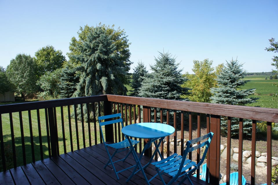 MASTER BEDROOM BALCONY: stunning farmland views, overlooks firepit