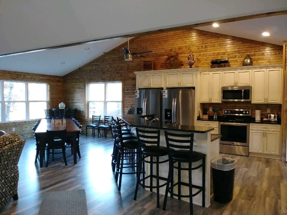 Dining table seats 12, bar table seats 4, island seats 7, outdoor patio seats 12