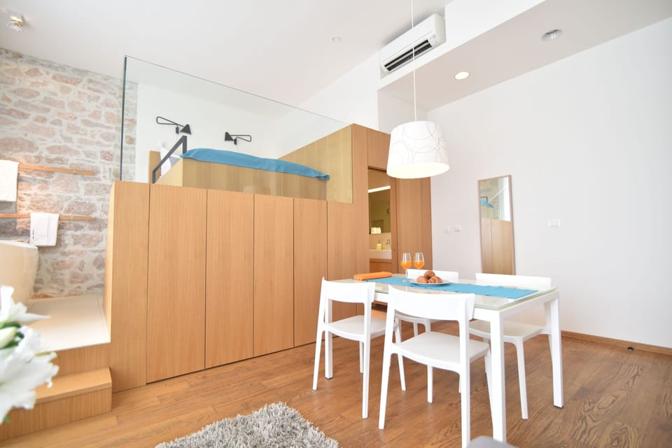 Deluxe Studio, Sea View | Living area | 102-cm flat-screen TV with satellite channels, Smart TV