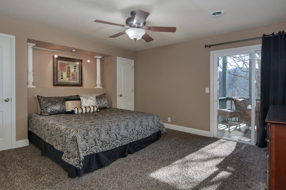 Main bedroom with access to screened porch