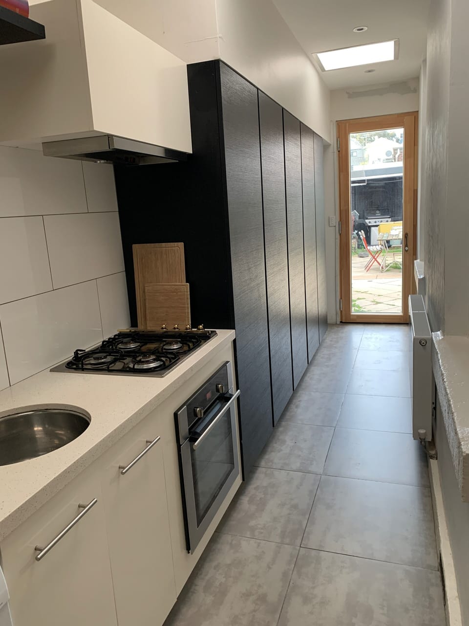 Galley kitchen.gas cooker, hydronic heating  double glazed aspect to court yard